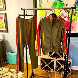 Women’s Puma tracksuit in a beautiful olive green with bright red stripe